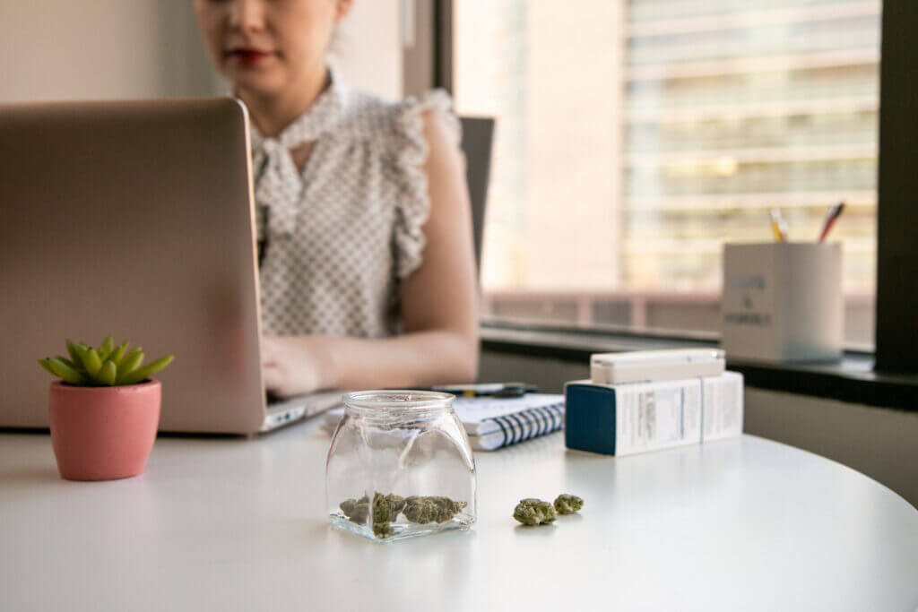 pa woman with cannabis on workdesk