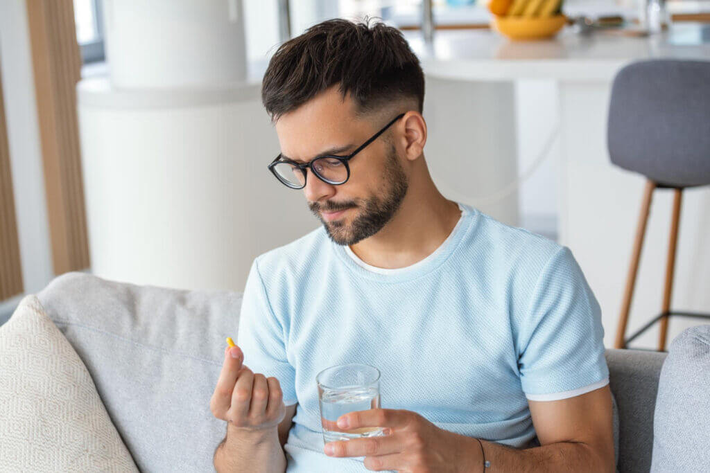 man on his computer looking for information about cannibus vs. anti-depressant for depression